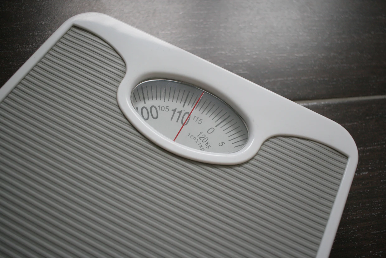 An ordinary analogue bathroom scale, with nobody standing on it.